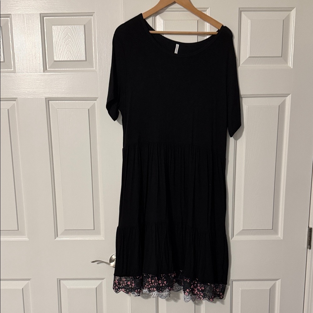 Elegant Black Dress with Floral Hem